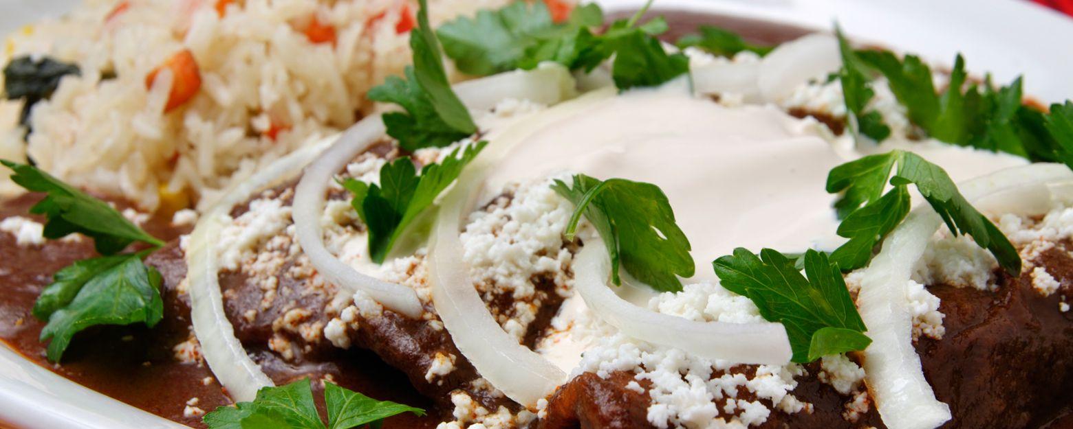 Black Bean Braised Enchiladas with Chorizo and Fresh Cheese