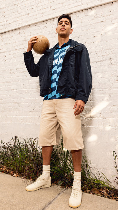 Edson Álvarez holding a soccer ball