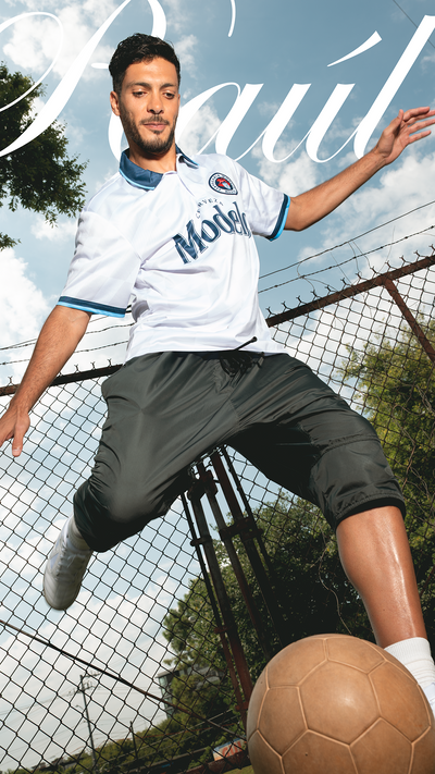 Raúl Jiménez in modelo jersey with soccer ball